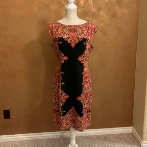 Dress, size 12, zipper under right arm, form fitting and great for travel.